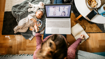 Woman working from home with a baby