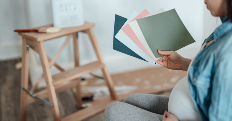 Pregnant woman decorating her nursery