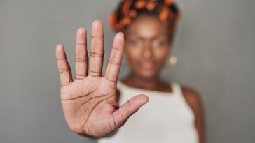 A woman putting her palm out