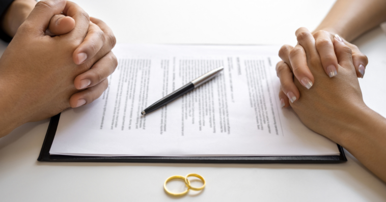 Two people filing divorce paperwork