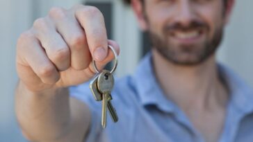 Man presenting set of house keys