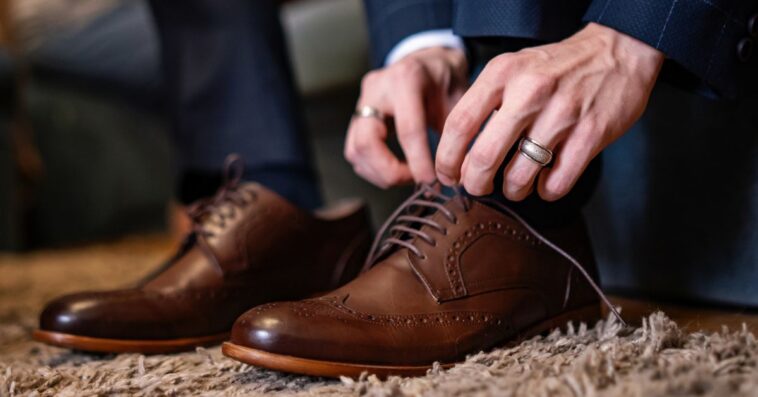 Man tying dress shoe laces