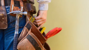 A man wearing a toolbetl.