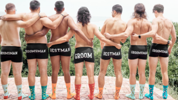 groom and his wedding party pose in briefs and socks