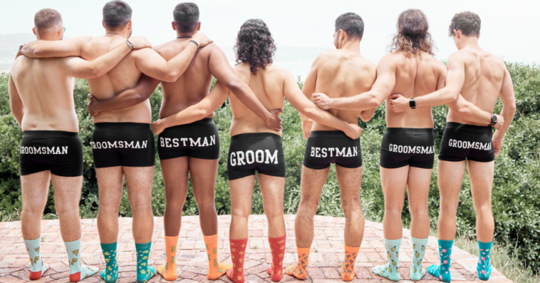 groom and his wedding party pose in briefs and socks