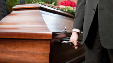 pallbearers carrying a casket