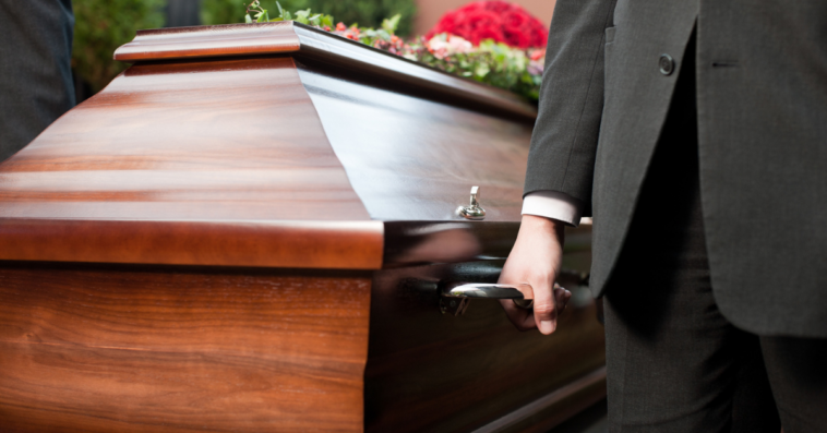 pallbearers carrying a casket