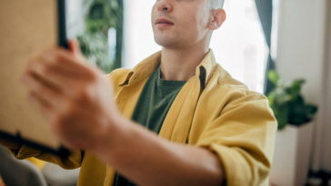 man holding up frame