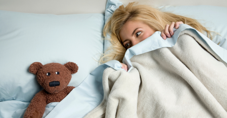Woman sleeping with a stuffed animal