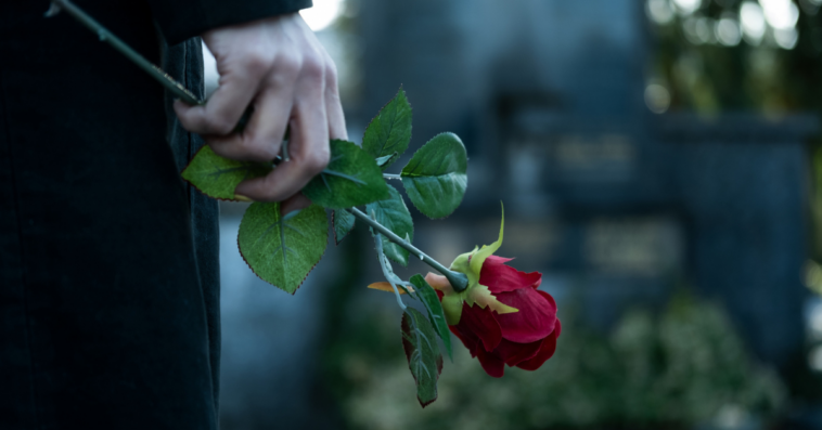 Woman at her mother's gravesite