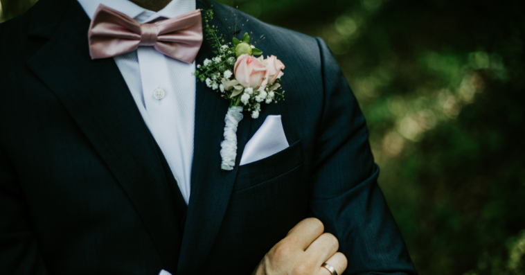 Angry groom with his arms crossed