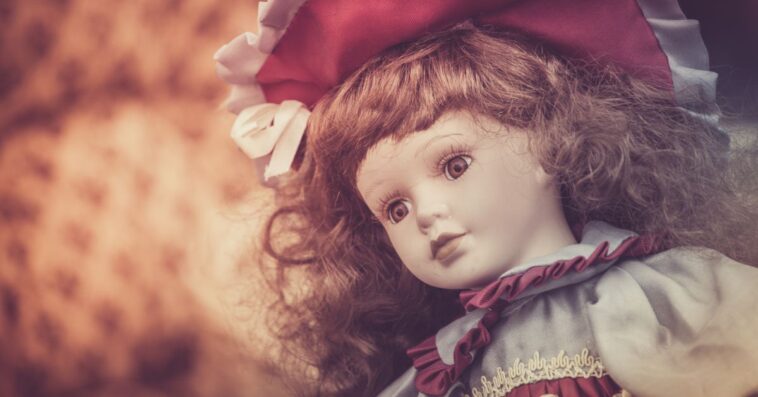 Close-up shot of a porcelain doll at a flea market.