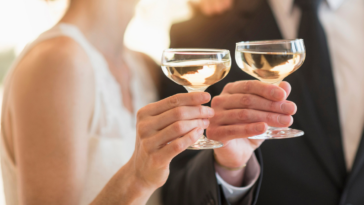 Bride and groom laughing at joke