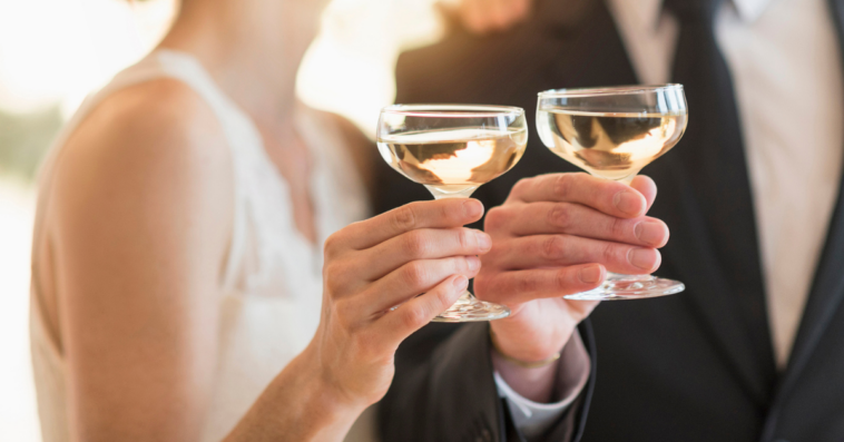 Bride and groom laughing at joke
