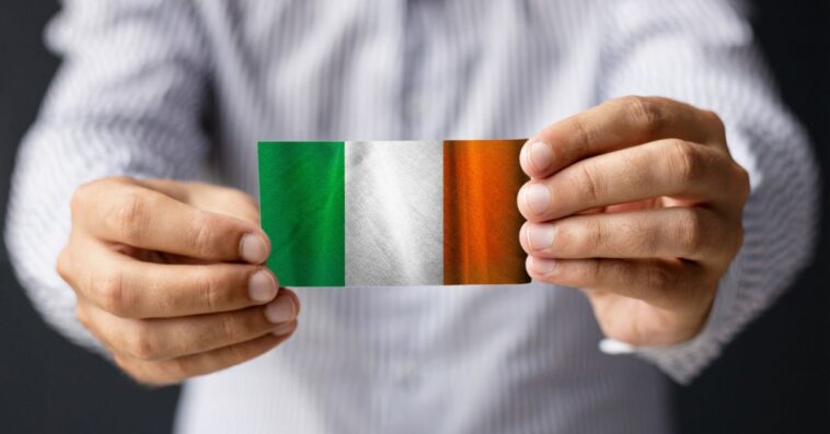 Person holding Irish flag