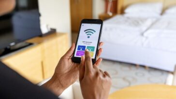 Person connecting to public Wi-Fi on cellphone