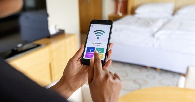 Person connecting to public Wi-Fi on cellphone