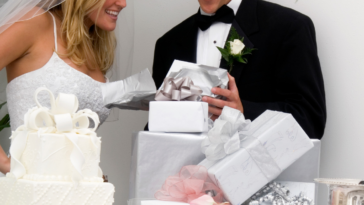 bride and groom opening wedding gifts