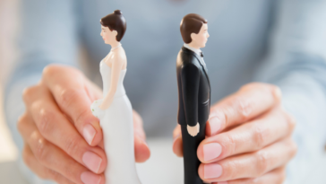 Wedding cake topper couple facing away from each other