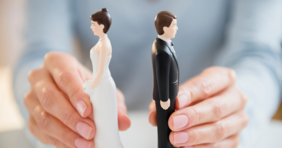 Wedding cake topper couple facing away from each other