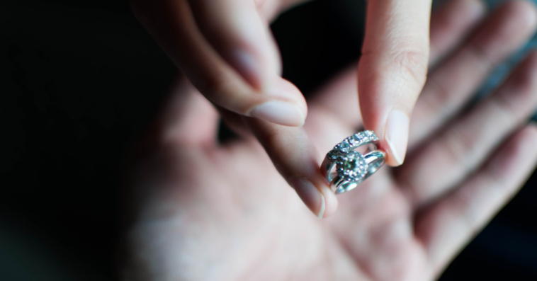 Woman returning engagement ring to man