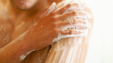 Man washing up in shower.