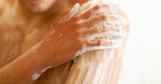 Man washing up in shower.