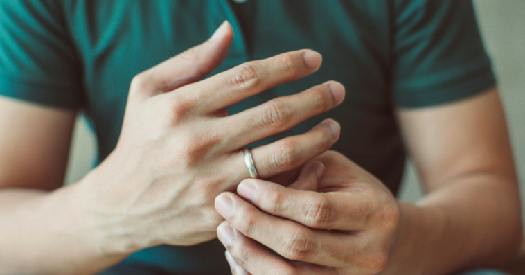 A man wearing a wedding ring.