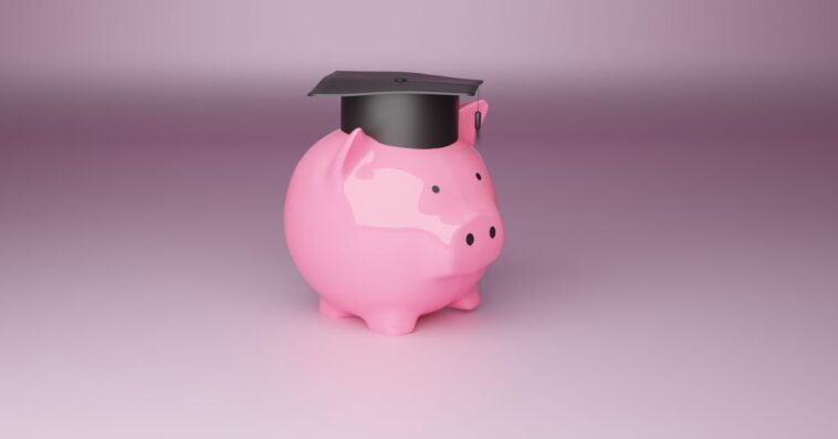 Digitally Generated Image of a piggy bank wearing a graduation cap.
