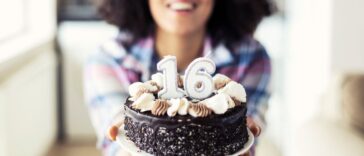 Woman holding a sweet 16 birthday cake