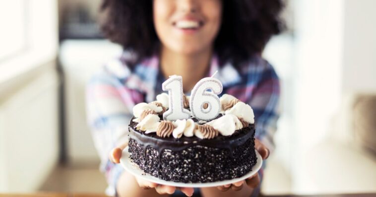 Woman holding a sweet 16 birthday cake
