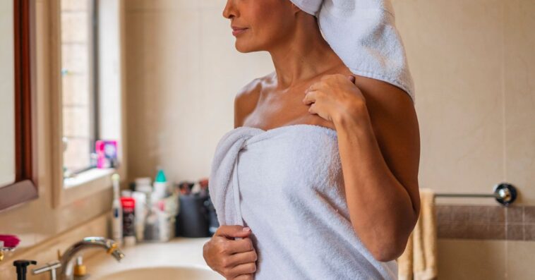 Woman after shower with towel wrapped around her head