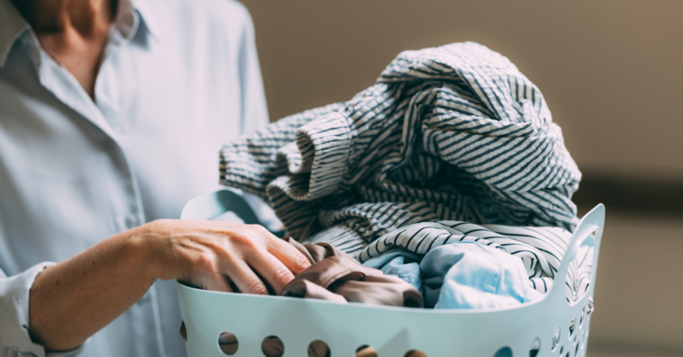 older woman with full laundry basket