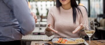 Unhappy restaurant patron complaining about her meal to server