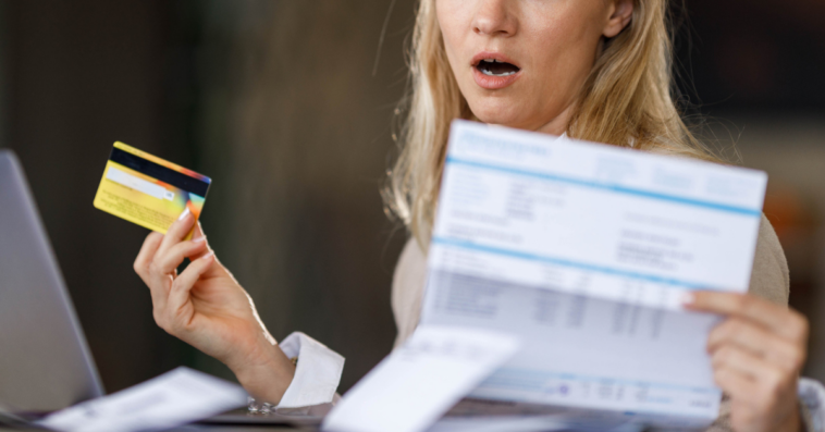 Woman with credit card realizing she's in trouble