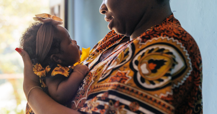 Nigerian mother holding baby girl