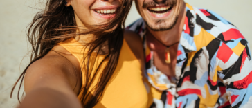 couple taking selfie on beach