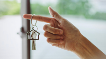 Person holding a house key