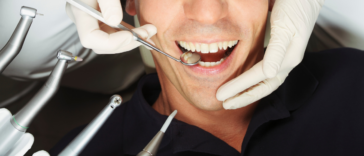 man getting his teeth cleaned
