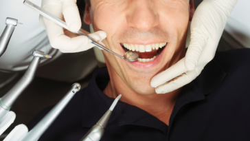 man getting his teeth cleaned