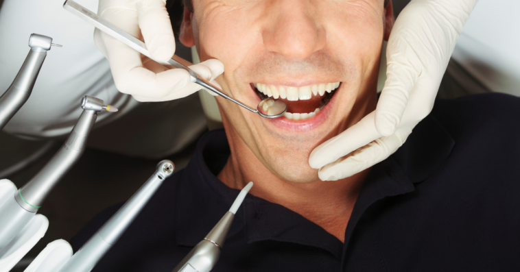 man getting his teeth cleaned