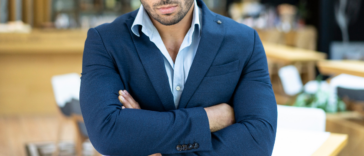 angry man in suit with arms crossed