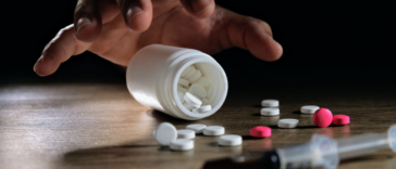 hand reaching for drugs
