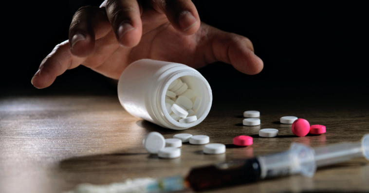 hand reaching for drugs