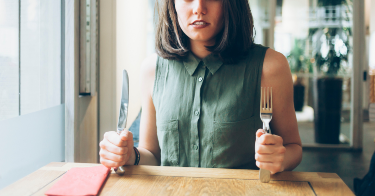 woman eagerly awaits food