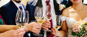 wedding party makes champagne toast at reception