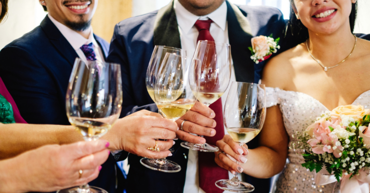 wedding party makes champagne toast at reception