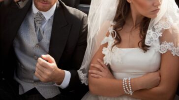 Newlywed couple arguing in car.