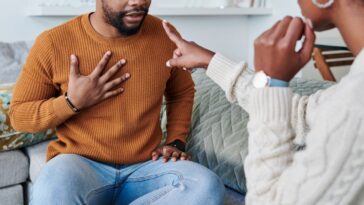 Shot of a young couple having an argument at home.