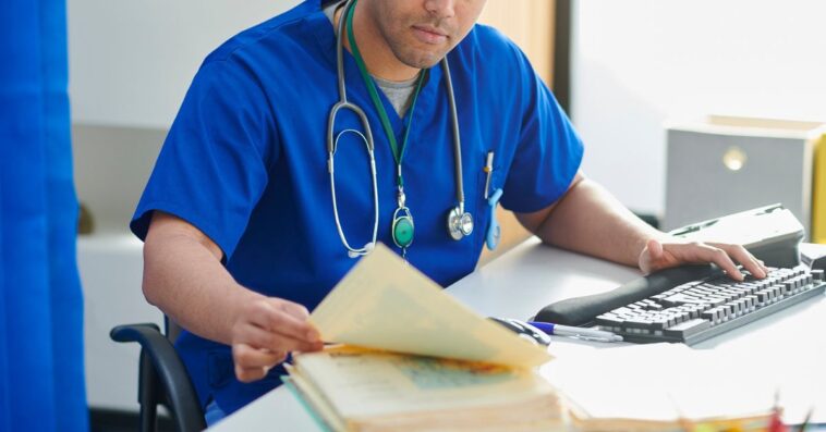 Junior doctor catching up on paperwork.